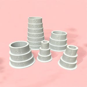 May include: A set of 10 plastic ring sizers in various sizes, ranging from 2.5 inches to 8 inches. The sizers are stacked in a pyramid shape, with the largest sizer at the bottom and the smallest sizer at the top.