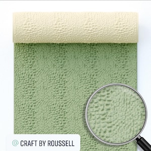 May include: A close-up of a green textured rolling pin with a magnifying glass showing the detail of the texture. The rolling pin is rolled up and the text "@CRAFT BY ROUSSELL" is visible in the bottom left corner.