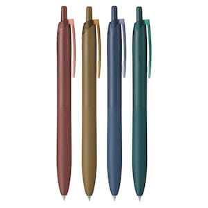 May include: Four Jetstream pens in a row. The pens are in shades of brown, gold, navy blue, and teal. Each pen has a colored clip and the text "Jetstream" printed on the barrel.