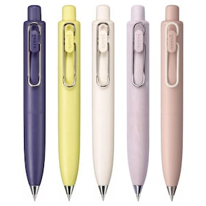 May include: Five pens in different colours: purple, yellow, white, light purple, and light pink. Each pen has a silver clip and a silver tip.