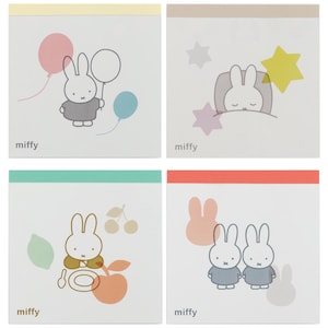May include: Four square notepads with colorful borders and illustrations of a bunny character. The bunny is depicted with balloons, sleeping under stars, with food, and with a friend. The word "miffy" is printed on each notepad.