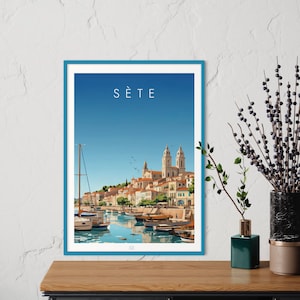 May include: A colourful illustration of the city of Sète, France, with a blue sky and a harbour filled with boats. The city is built on a hill and has a large church with two towers. The text "Sète" is printed in white at the top of the image.