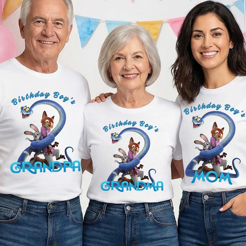 May include: Three white t-shirts featuring a graphic of a blue snake wrapped around a fox and a rabbit. The text reads Birthday Boy's with the words GRANDPA, GRANDMA, or MOM below. The shirts are paired with blue denim jeans.