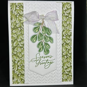 Carte de Noël élégante avec un motif botanique et des feuilles en relief