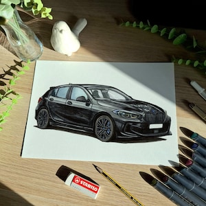 May include: A detailed marker drawing on white paper depicting a black BMW 1 Series hatchback. The vehicle is shown from a front three-quarter angle, featuring dark multi-spoke wheels, a signature kidney grille, and sleek headlights.