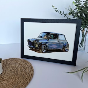 May include: A framed art print featuring a detailed illustration of a grey compact car with a boxy silhouette, round headlights, and wide wheel arches. The car is depicted in a side profile view against a plain white background within a black frame.
