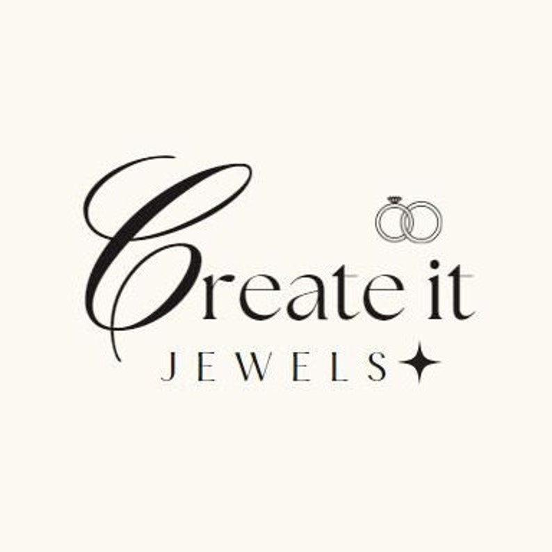 Peut inclure: Logo de Create it Jewels avec une police cursive stylis&eacute;e avec les mots "Create it" et le mot "Jewels" en dessous dans une police plus petite. Un petit graphique de deux anneaux entrelac&eacute;s avec un diamant sur un anneau est au-dessus du mot "Create".