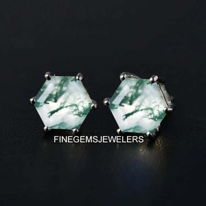 May include: A pair of silver stud earrings with hexagonal green and white agate stones.