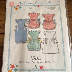 May include: A sewing pattern titled "Brylee" for baby bib play suits and a sun dress. The pattern includes illustrations of the garments in various colors and patterns, with sizes for babies and toddlers. The text "Sew Something Sweet for Baby" is at the top.