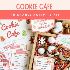 May include: A printable Cookie Cafe activity kit with a variety of elements. Includes a sign that says "Welcome to the Cookie Cafe", gingerbread men, and a menu. The kit features a wooden tray with decorative items.