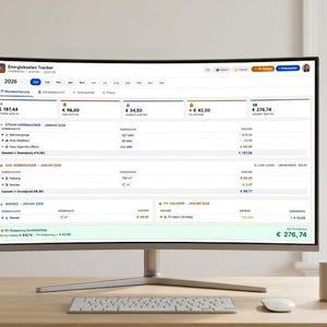 May include: A curved computer monitor displays a financial tracking application with the text "Energiekosten Trecker" at the top. The screen shows financial data, including costs and consumption figures. A keyboard, mouse, and a mug are on the desk.