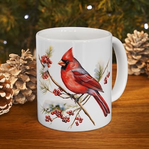 Winter holiday coffee mug with beautiful red cardinal design.  White ceramic Mug 11oz or 15oz makes a great holiday gift.