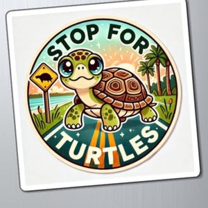May include: A round sticker with a cartoon turtle crossing a road with the text "Stop for Turtles". The turtle is green and brown with big eyes. The road is yellow and orange with a green grassy area on either side. There are palm trees in the background.
