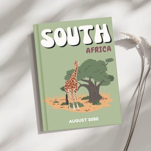 May include: A green journal with the words "SOUTH AFRICA" in white and "AFRICA" in maroon. The cover features a giraffe, a tree, and the text "AUGUST 2050". The journal has a light green cover and a white background.