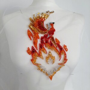 Embroidered applique phoenix patch bird beaded applique on an evening dress, denim jacket, handbag, coat or other clothes.