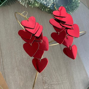 Love Bomb cascading heart earrings designed from genuine leather, ideal for romantic gifts and special occasions.