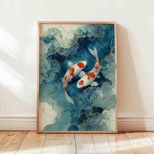 May include: A framed art print featuring two koi fish swimming in a blue and white abstract design. The fish are white with red markings. The artwork is in a wooden frame and is displayed on a wall.