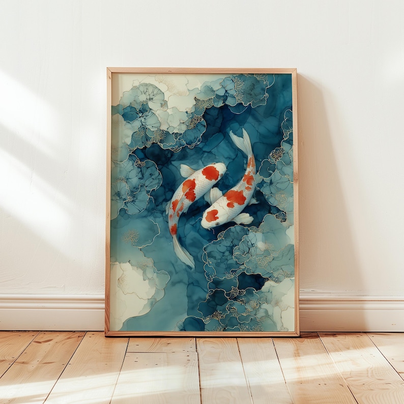 May include: A framed art print featuring two koi fish swimming in a blue and white abstract design. The fish are white with red markings. The artwork is in a wooden frame and is displayed on a wall.