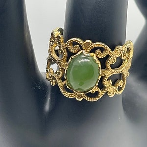 Vintage Costume Statement Ring (green stone and gold colored band)