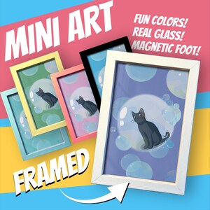 May include: Mini art framed prints featuring a black cat inside a bubble, with a blue, green, pink, yellow, and black frame. The prints have the text "Mini Art" and "Framed". The text "Fun Colors! Real Glass! Magnetic Foot!" is also visible.
