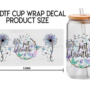 May include: A clear glass tumbler with a bamboo lid and a straw. The tumbler has a decal with a dandelion design and the text "Just Breathe". The decal is 4.3 inches tall and 9.3 inches wide.