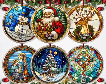 May include: Six round Christmas ornaments featuring stained glass style illustrations of a snowman, Santa Claus, a reindeer, the Nativity scene, a decorated Christmas tree, and a cross. Each ornament includes a name and the year 2026 printed below.