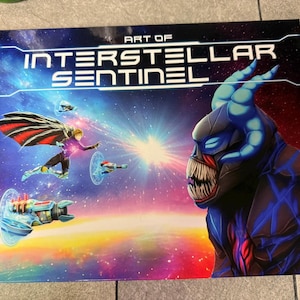 May include: A book cover with the title "Art of Interstellar Sentinel" in a futuristic font. The cover features a blue and red alien creature with sharp teeth and a glowing background with stars and spaceships.