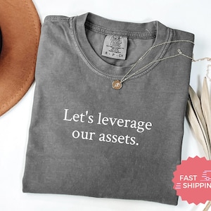 Comfort Colors® Let's Leverage Our Assets Funny Work Shirt, Corporate Jargon Office Humor T-Shirt, Business Manager Gift, Entrepreneur Tee