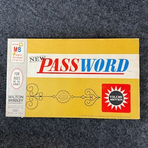 May include: A vintage board game box for "New Password" by Milton Bradley. The box is yellow with red and blue text, featuring the game title and "Volume Seven." Includes text "For Ages 10 to Adult" and "Made in USA."
