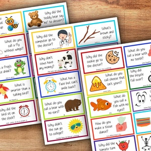 Pode incluir: Um conjunto de 20 cartas coloridas com piadas e enigmas para crian&ccedil;as. Cada carta apresenta uma ilustra&ccedil;&atilde;o diferente e uma pergunta. As perguntas s&atilde;o escritas em uma fonte grande e em negrito. As ilustra&ccedil;&otilde;es s&atilde;o brilhantes e alegres.