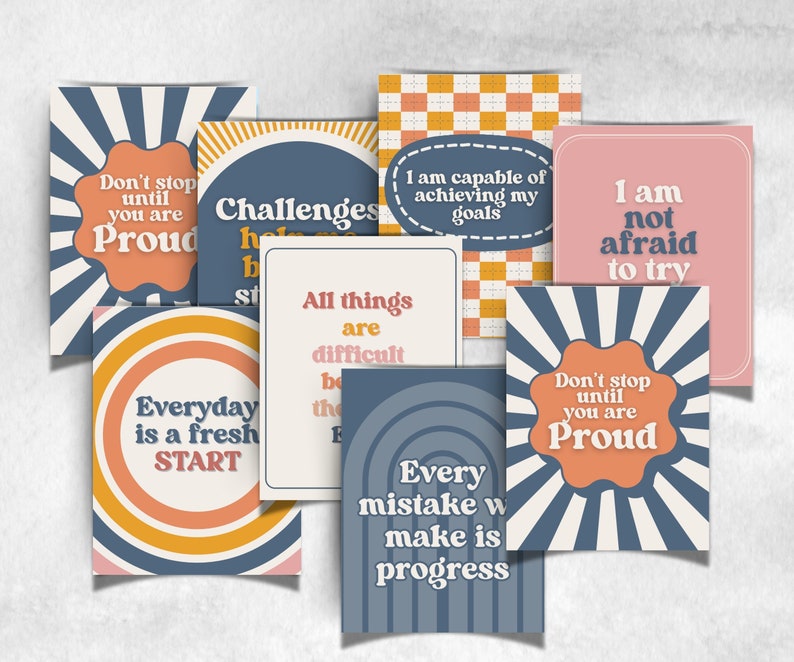 May include: A selection of retro-themed motivational cards. Each card displays an inspirational quote in a variety of fonts and colours, such as orange, blue, and pink. The cards are arranged on a light background.