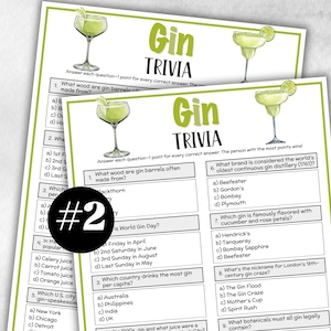 Op de afbeelding: Twee gedrukte "Gin Trivia" spelkaarten. Elke kaart heeft een aquarel illustratie van een cocktail en trivia vragen over gin. De titel "Gin Trivia" is groen, op een witte achtergrond.