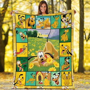 May include: A yellow and green fleece blanket with a patchwork design featuring various images of Pluto the dog from Disney. The blanket has the text "Did you say party?" and "Name" in a white font.