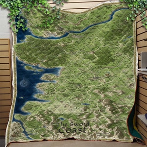 May include: A green and blue map of The Sword Coast, a fictional region from the Dungeons & Dragons fantasy role-playing game. The map features a coastline, mountains, rivers, and forests. The text "The Sword Coast" is printed in the center of the map, along with the text "FOR ADVENTURE" and "IN MY WORLDS".