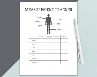 May include: A white Measurement Tracker sheet with a diagram of a human figure and a table for tracking weight and body measurements over four weeks. A white pen rests on the right side of the sheet. The text "MEASUREMENT TRACKER" is at the top.