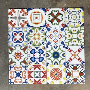 May include: A set of 16 ceramic tiles with a variety of colourful geometric patterns. The tiles are arranged in a 4x4 grid and feature a mix of blue, green, red, yellow, and white colours.