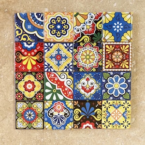 May include: A set of 16 colourful ceramic tiles with intricate floral patterns in shades of blue, red, yellow, and green. The tiles are arranged in a square grid.