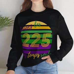 May include: Black sweatshirt with a green, yellow, and purple graphic of a sunset with the text "Laissez les bons temps rouler" and the number "225" in the center.