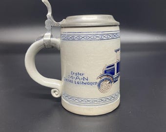 VTG Goebel Maschinenfabrik Augsburg-Nürnberg MAN bierpul met herdenkingsmunt deksel