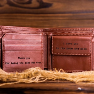 May include: Brown leather wallet with a personalized message inside. The message reads "Thank you for being the best Dad ever." and "I Love you to the moon and back".