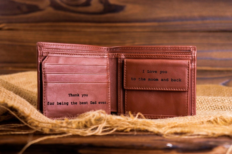 May include: Brown leather wallet with a personalized message inside. The message reads "Thank you for being the best Dad ever." and "I Love you to the moon and back".