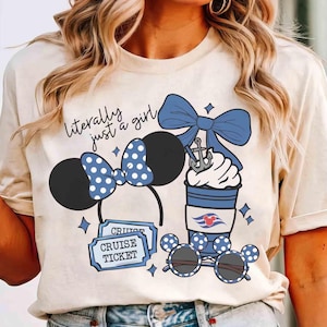 May include: Beige t-shirt with a graphic featuring a Minnie Mouse ear headband, sunglasses, and a coffee cup, all with blue polka dots. The text "literally just a girl" is above the ears. Includes cruise tickets.