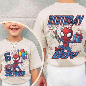 May include: Beige t-shirt featuring a Spider-Man graphic. The front design includes the number 5, a birthday cake, and the name "Oliver." The back of the shirt displays "Birthday Boy" and another Spider-Man graphic. Balloons and confetti are also included.