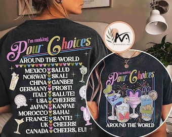 May include: Dark gray t-shirt with the text "I'm making Pour Choices Around The World." The design includes cocktail glasses and country greetings. A circular graphic shows cocktails and fireworks. The shirt is from Marabou Art.