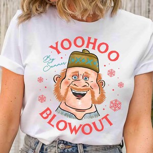 May include: White t-shirt featuring a cartoon character with a brown beard and hat. The text "Yoohoo Blowout" is in red, with "Big Summer" in teal. Red snowflakes are scattered around the design.