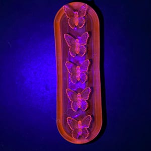 Blue Vaseline Glass Selenium Pink UV Glow Butterfly on Font