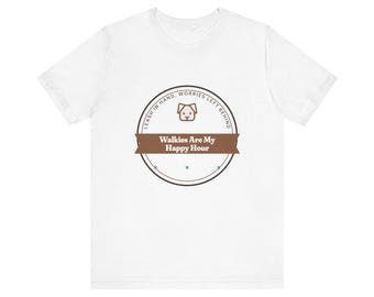 May include: A white short-sleeved t-shirt featuring a circular brown graphic on the chest. The design includes a dog icon, the text "LEASH IN HAND, WORRIES LEFT BEHIND" around the border, and a brown banner with "Walkies Are My Happy Hour".