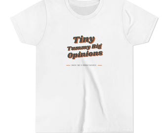 May include: A white short-sleeved t-shirt featuring the text "Tiny Tummy Big Opinions" in dark blue with orange outlines, followed by the smaller text "SNACK TIME IS SERIOUS BUSINESS" centred between two horizontal orange lines.