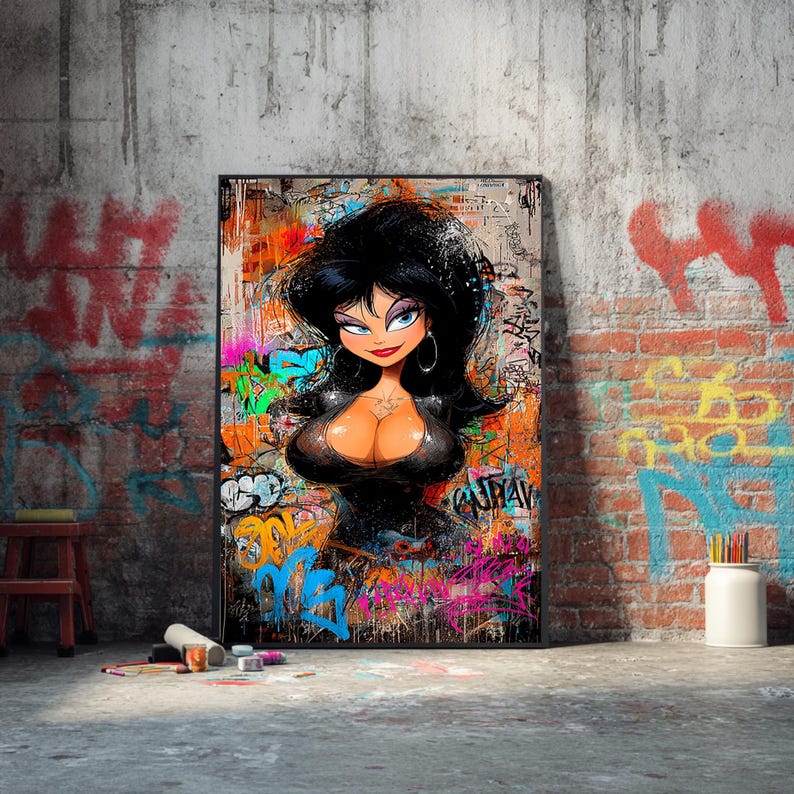 May include: A framed artwork featuring a cartoon woman with black hair, blue eyes, and red lips. The artwork is set against a backdrop of graffiti art with vibrant colors like orange, blue, and pink. The artwork is displayed against a brick and concrete wall.