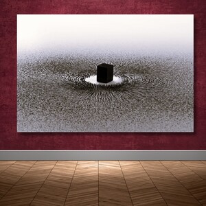 May include: A black and white abstract art print depicting a black cube surrounded by a swirling pattern of lines. The lines appear to be radiating outward from the cube, creating a sense of movement and energy.